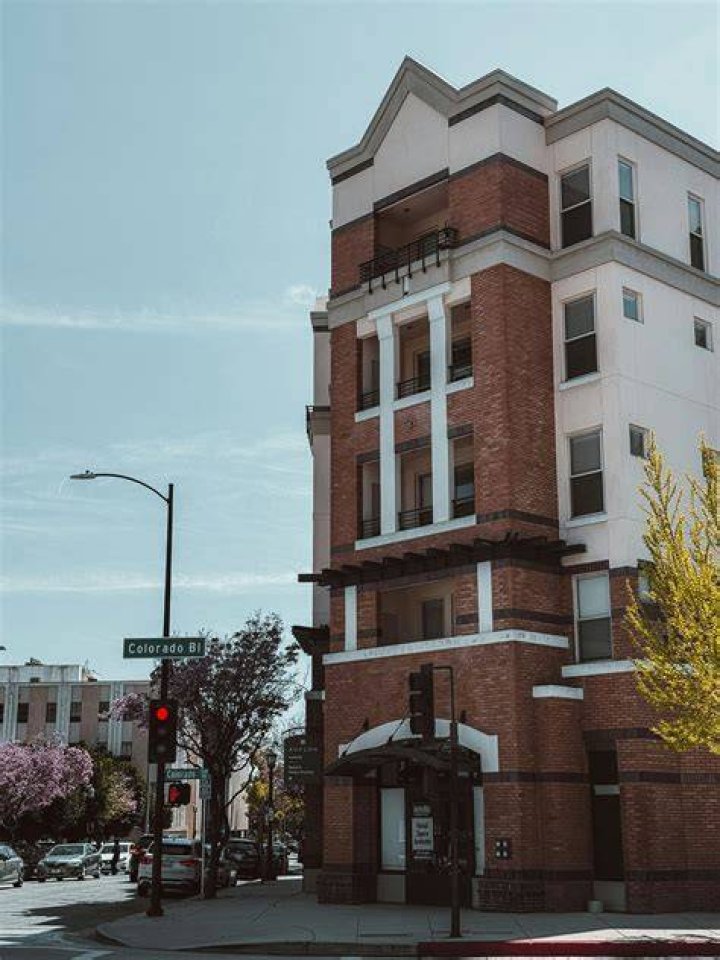 A tall brick building sitting next to a tall brick building photo Free Building Image on Unsplash