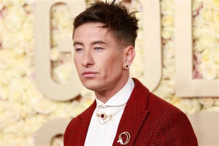 Barry Keoghan Attends 2024 Golden Globes in Dashing Red Suit and Pearl