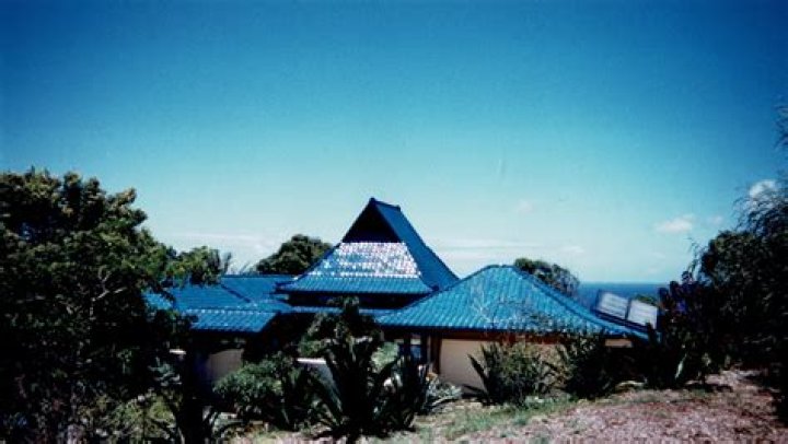 Blue house facing the Sea Sacred Space Architecture