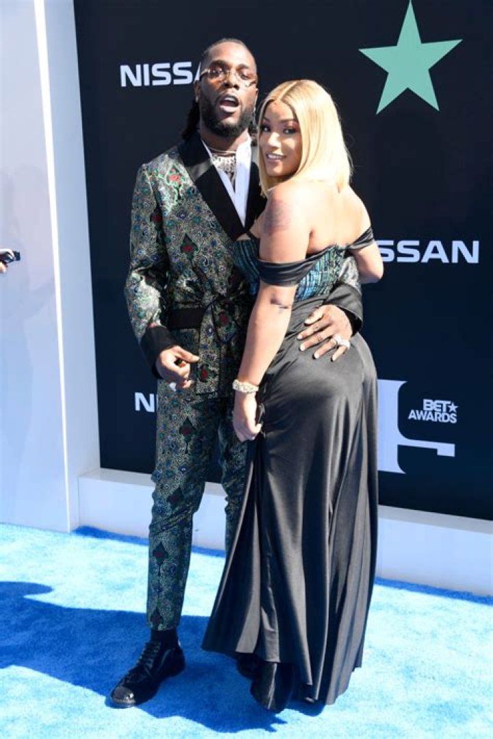 Burna Boy and Stefflon Don share a romantic kiss as they mark their one
