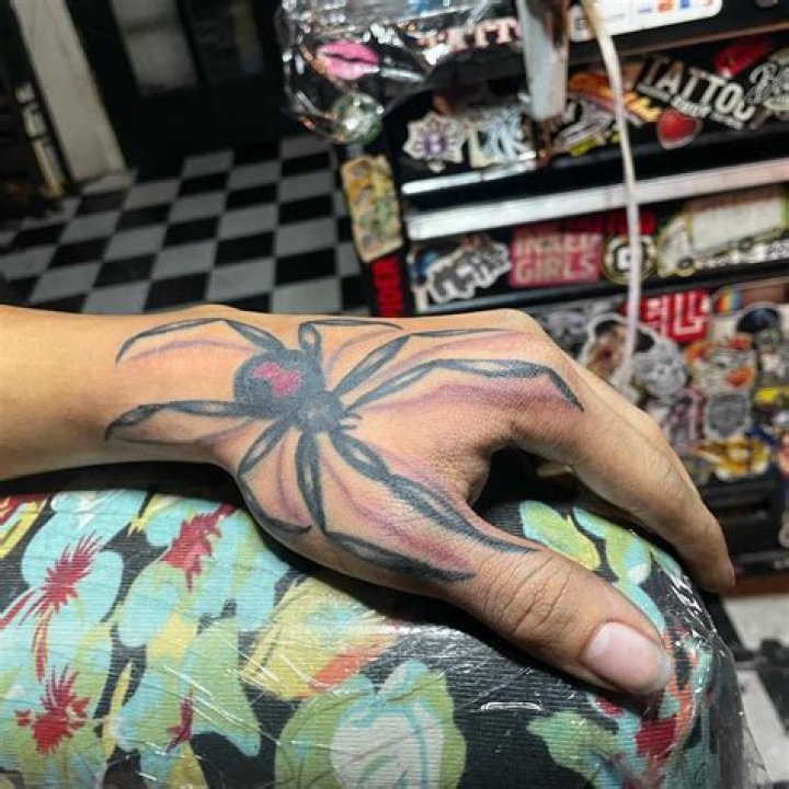 Discover 69+ black widow hand tattoo in.cdgdbentre