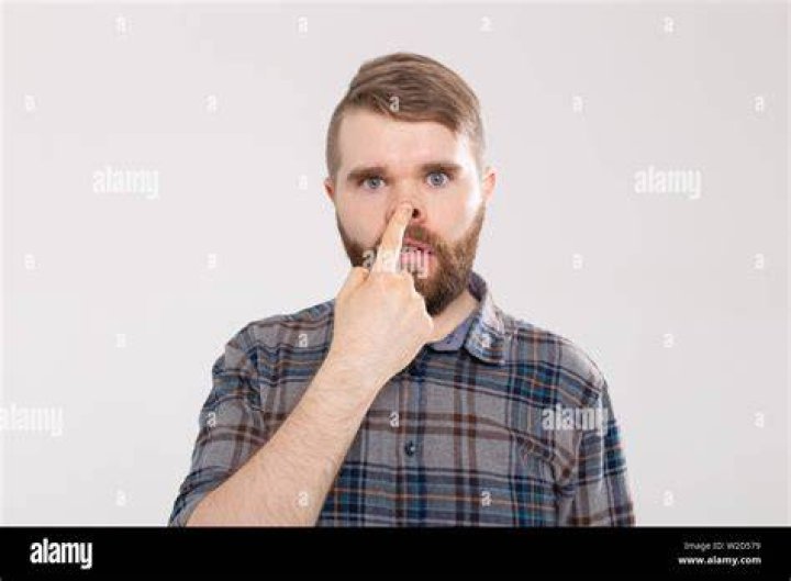 Funny Crazy Playful Handsome Man in Plaid Shirt Making Silly Face. Guy