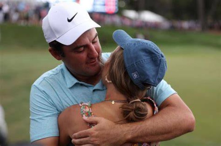 Scottie Scheffler hugs wife Meredith after Players Championship win