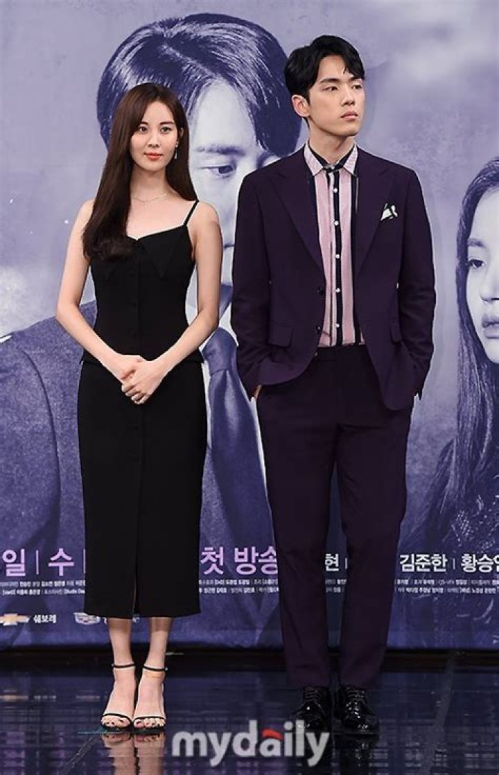 Seohyun And Kim Jung Hyun Are A Somber Bride And Groom For Their