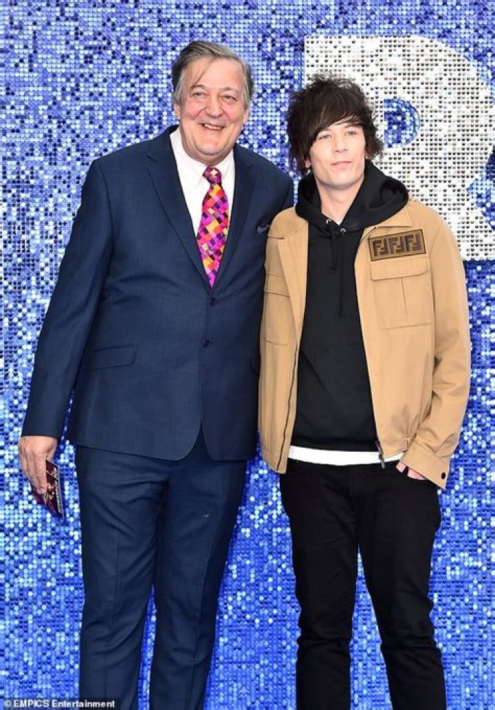 Stephen Fry and husband Elliott, 29, arrive at Wimbledon Daily Mail