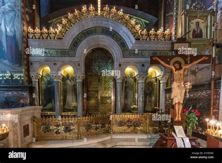 the altar is decorated with flowers and candles